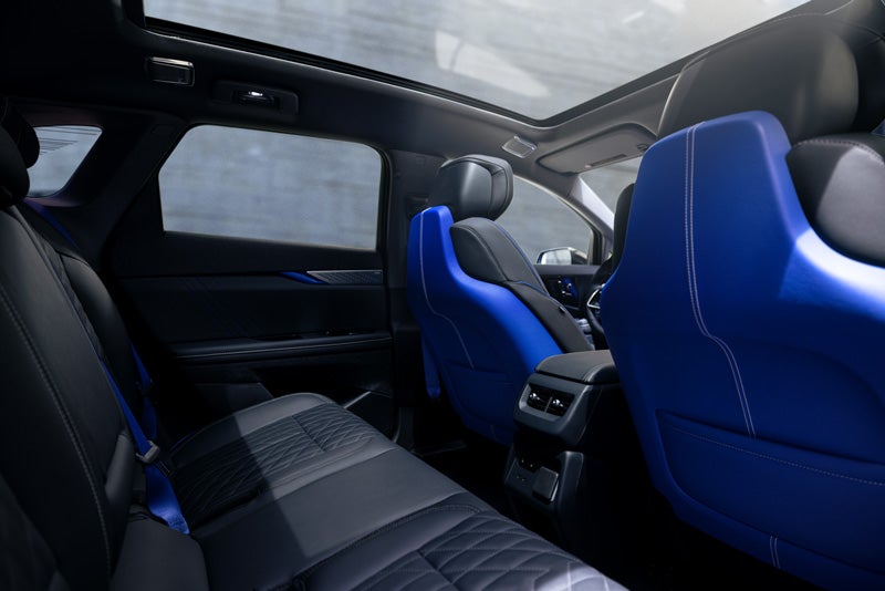 Back Seat View of the 2026 OPTIQ-V Blue Front Seats, Sun Roof, and Interior | Palmen Cadillac in Kenosha WI